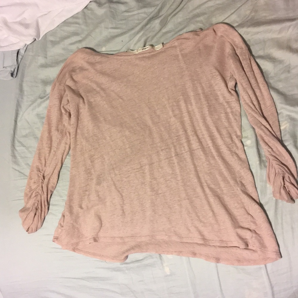 Long sleeve pink T-shirt.